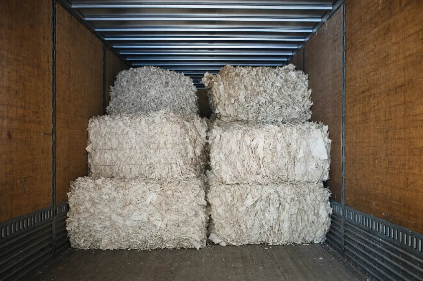 Mill size bales filling a trailer to its weight limit